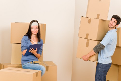 Professional movers handling a few bulky items in Friernbarnet